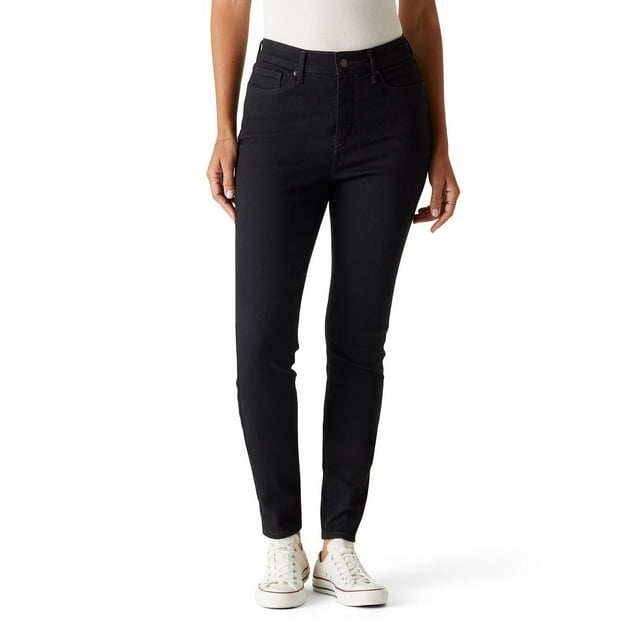Levi Strauss Signature™ Women's black high rise skinny jeans styled with white sneakers.
