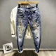 thumbnail image 4 of Pantalones vaqueros con bolsillos recortados de estrellas para hombre, pantalones vaqueros masculinos con gráficos, azul claro, venta al por mayor, alta calidad, estilo retro, informal, tallas XS, 4 of 5