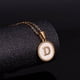 thumbnail image 4 of Collar de acero inoxidable con letras en forma de concha de color dorado redondo para mujer, colgante de acero de titanio de estilo europeo y americano con 26 letras en inglés, 4 of 6