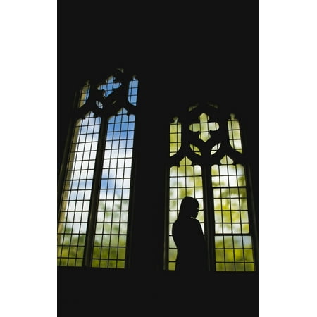 Silhouette of a girl standing by a stained glass window Vancouver British Columbia Canada Poster Print by Nathan Lau  Design