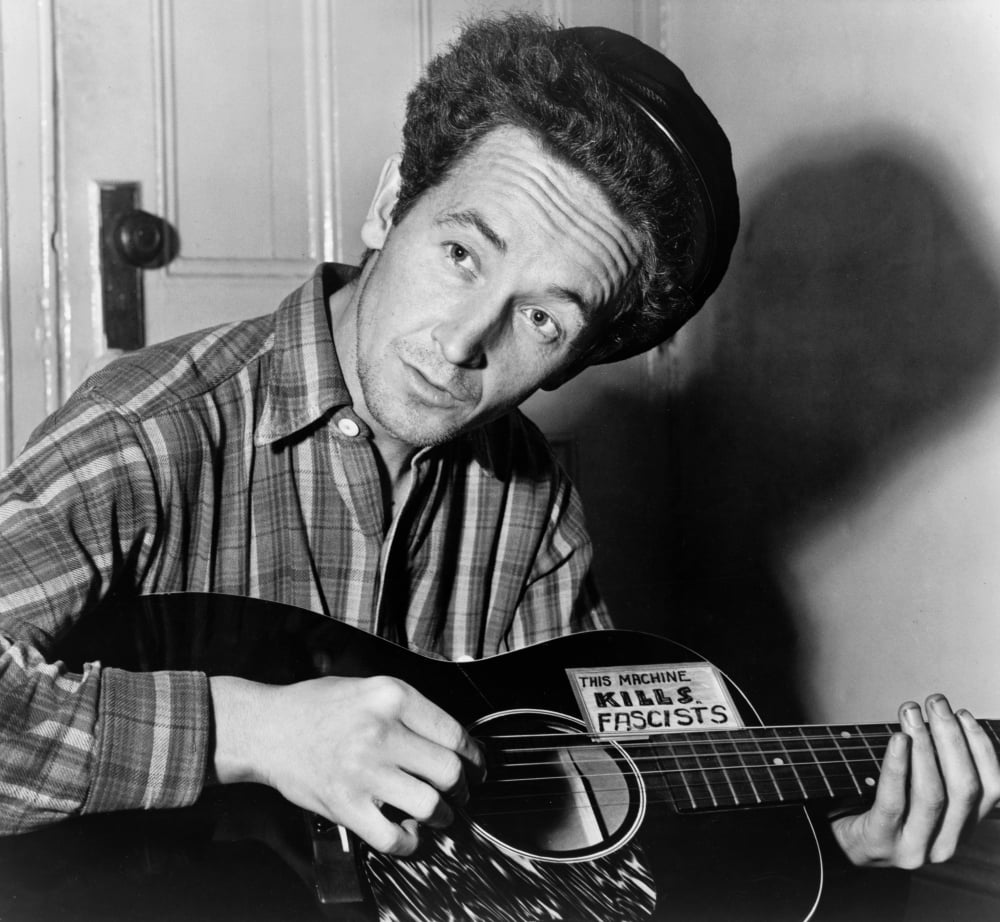 Woody Guthrie (1912-1967) Namerican Folk Singer Photographed Playing A ...