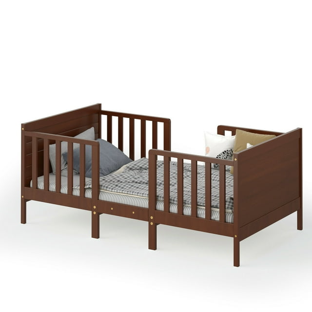 Gymax 2-in-1 Convertible Toddler Bed Kids Wooden Bedroom Furniture with guardrails in brown finish. This classic toddler bed features a sturdy rubber wood and poplar frame, four safety side rails, and a smooth surface to protect delicate skin. It can be converted into two kids chairs, making it versatile furniture for spaces like kids' rooms or kindergartens. The low ground clearance allows toddlers over 15 months to climb in and out easily, promoting independence.