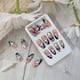 thumbnail image 2 of Uñas postizas medianas almendradas con puntas francesas azules y diseño floral blanco, juego de 24 piezas., 2 of 4