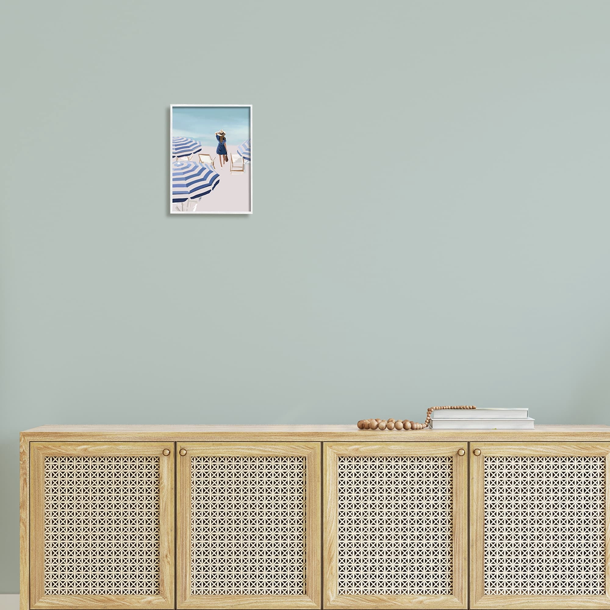 Stupell Industries Woman Enjoying Beach Shore Umbrellas Coastal Scene Graphic Art White Framed Art Print Wall Art, Design by Amelia Noyes