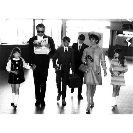 - Elizabeth Taylor and Richard Burton with their children in Nice airport Photo Print