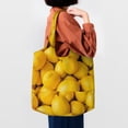 thumbnail image 4 of Xecao's Ripe Yellow Lemon Canvas Tote Bag is a versatile choice for women, serving as a stylish beach bag, shopping bag,and reusable grocery bag., 4 of 5