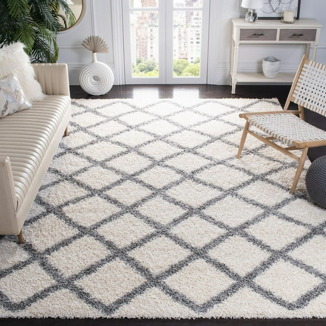 Safavieh Dallas Jerrie shag area rug featuring a gray geometric diamond pattern on cream background in modern living room.