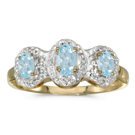 - 10k Yellow Gold Oval Aquamarine And Diamond Three Stone Ring
