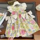thumbnail image 1 of Vestido sin mangas con estampado de flores y orejas de madera con lazo doble para niña de verano, 1 of 6