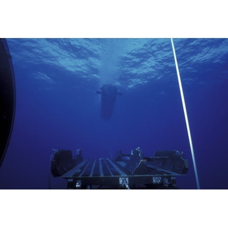 - A SEAL Delivery Vehicle approaches the Dry Deck Shelter buoyed rendezvous line as seen from the empty DDS track and cradle system during submarine operations off the coast of Hawaii in 1994 Poster Pri
