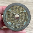 thumbnail image 4 of Exquisitely crafted antique-style copper coins, including those depicting mountain spirits, Laozi (the Supreme Lord Lao), and high-relief auspicious symbols of good fortune and longevity., 4 of 4