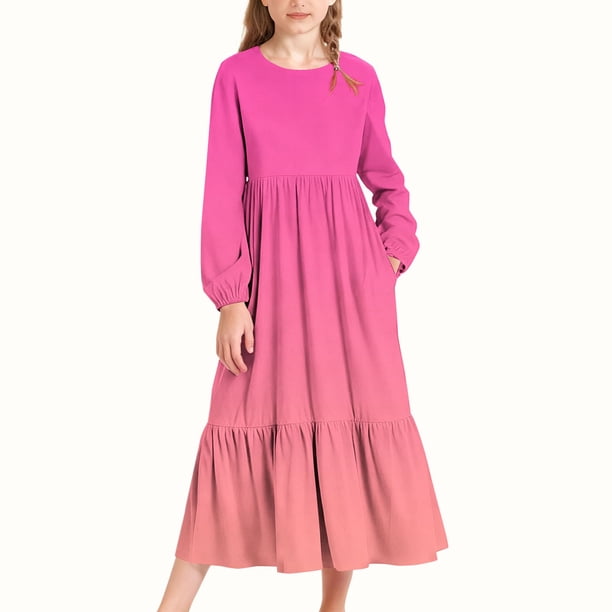 Vestido infantil de poliéster de manga larga, cuello redondo, bolsillos laterales y falda larga.