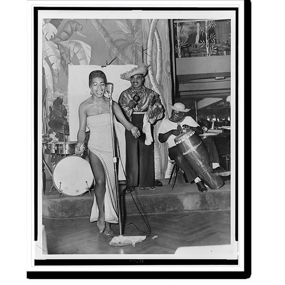 Historic Print, Maya Angelou, a barefoot favorite of calypso devotees, plays havoc with an original African number, 16" x 20"