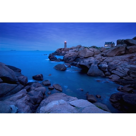 Small Lighthouse And House At Dusk Canvas Art - Ian Cumming  Design Pics (34 x 22)
