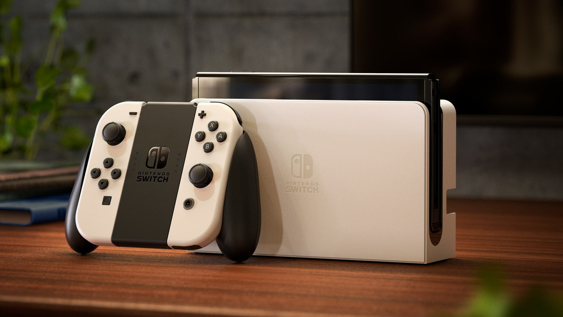 Nintendo Switch (modèle OLED) avec station d’accueil et manettes Joy-Con  blanches