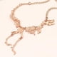 thumbnail image 3 of Collar de esqueleto de dinosaurio Oro rosa, 3 of 8