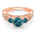 thumbnail image 2 of Gem Stone King 18K Rose Gold Plated Silver London Blue Topaz and White Moissanite Engagement Ring for Women (1.63 Cttw, Gemstone November Birthstone, Round 6MM and 3MM, Size 8), 2 of 4