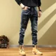 thumbnail image 2 of Pantalones vaqueros rotos con agujeros para hombre, pantalones cargo con gráficos, pantalones vaqueros para hombre, ropa de otoño rota, estilo retro, algodón apilado, informal, 2 of 5
