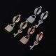thumbnail image 2 of Pendientes Minimalistas Yashi con Forma de Llave y Candado de Oro y Plata, 2 of 5