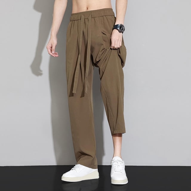 Pantalones largos de poliéster para hombre, moda informal, color liso, rectos, con bolsillos y cordón ajustable.