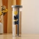 thumbnail image 1 of Botella de agua plegable con separador de té y pajita, portátil y resistente a caídas. Marco metálico, diseño de 2 niveles, plegable y ajustable. Ideal para dormitorios, filtración de agua,, 1 of 7