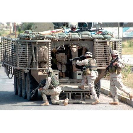 Soldiers load in to the Stryker Armored Personnel Carrier Poster Print by Stocktrek (Best Armored Personnel Carrier)