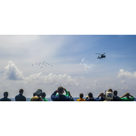 LAMINATED POSTER Sailors and civilians watch Carrier Air Wing (CVW) 5 aircraft fly in formation during an air power d Poster Print 24 x