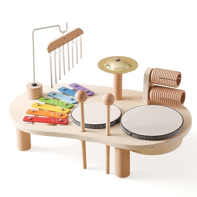 KEINXS Early Learning Multifunctional Music Table Toy featuring a portable percussion playset for youngsters. The wooden table includes a xylophone with rainbow-colored keys, two drum pads, a cymbal, chimes, and a guiro. Designed for educational musical enlightenment, it promotes early learning and creativity.