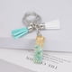 thumbnail image 2 of Llavero de letras con borlas verdes | Colgante de cristal acrílico | Lámina de oro, pegamento en gota, joyería de piedra engrosada | Amuleto de bolso con estilo, accesorio para mochila | 1 pieza, 2 of 2