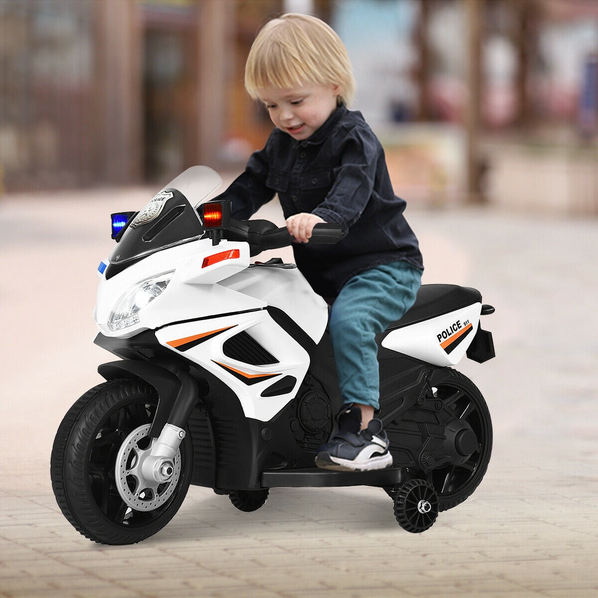 kid riding motorcycle with dad