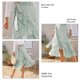 thumbnail image 3 of Falda cruzada con lazo para mujer, estampado floral, ribete con volantes, diseño dividido, longitud media, dobladillo fluido, falda de verano con forro, 3 of 6