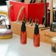 thumbnail image 3 of 20 piezas de plástico mini botella de aerosol pequeña vacía para maquillaje y cuidado de la piel Uso de viaje recargable (marrón con pulverizador negro), 3 of 6