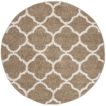 Safavieh New York Shag SG168 Indoor Area Rug The quatrefoil design and plush  shag texture of the Safavieh New York Shag SG168 Indoor Area Rug can accent your transitional or global living or dining room. This cozy rug feels great under your feet and has a solid-colored background with a contrasting  light quatrefoil pattern from edge to edge. Choose from available colors.