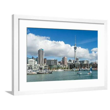 Small sailboats cruise in Auckland harbour in front of the city skyline, Auckland, New Zealand Framed Print Wall Art By Logan