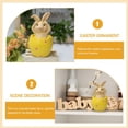 thumbnail image 4 of El Conejo de Pascua se sienta en la cáscara del huevo y no escucha, mira ni habla sobre la decoración de la mesa. MFZFUKR BST3012460-1, 4 of 5
