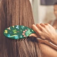 thumbnail image 4 of Bright Dinosaur Paddle Brush - Anti-Static & Shine Enhancing, Cartoon Dino Design, Great for Women & Girls, 4 of 5