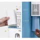 thumbnail image 2 of Soporte para cepillos de dientes de pared sin taladro, dispensador de pasta de dientes y ranuras multifunción para baño, 2 exprimidores de pasta de dientes con 4 tazas, 2 of 4