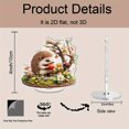 thumbnail image 2 of Rotating acrylic ornament featuring a colorful hedgehog enjoying an apple amidst detailed grass and vibrant flowers. Perfect decorative piece, 2 of 7