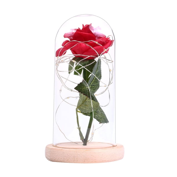 Lámpara decorativa con rosa artificial y cubierta de vidrio, ideal para regalos románticos en San Valentín o Día de la Madre. Base de madera en color beige, luz cálida LED y función de encendido