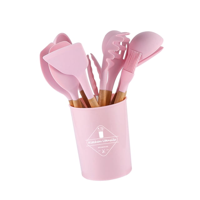kit de utensilios de cocina con mango de madera, kit de utensilios de cocina de silicona antiadherente Jadeshay — set de 11 piezas en rosa con cubo de almacenamiento; incluye espátula, cuchara, tenazas, batidor, cepillo y colador, cabezas de silicona y mangos de madera visibles sobre fondo blanco; también apto como organizador compacto para utensilios pequeños.