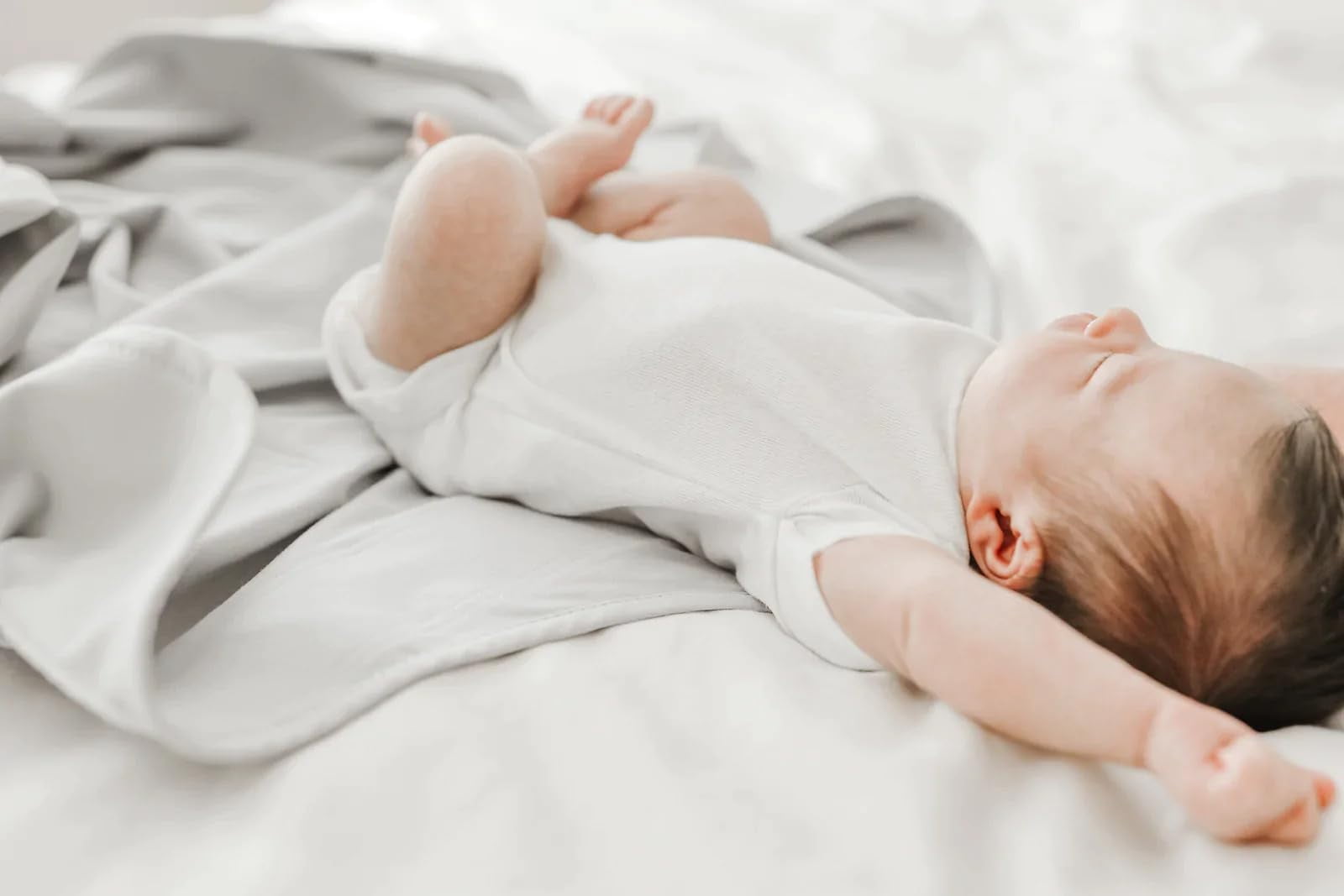 The Ollie Swaddle -- Helps to reduce the Moro (startle) reflex -- Made from a custom designed moisture-wicking material (Stone)