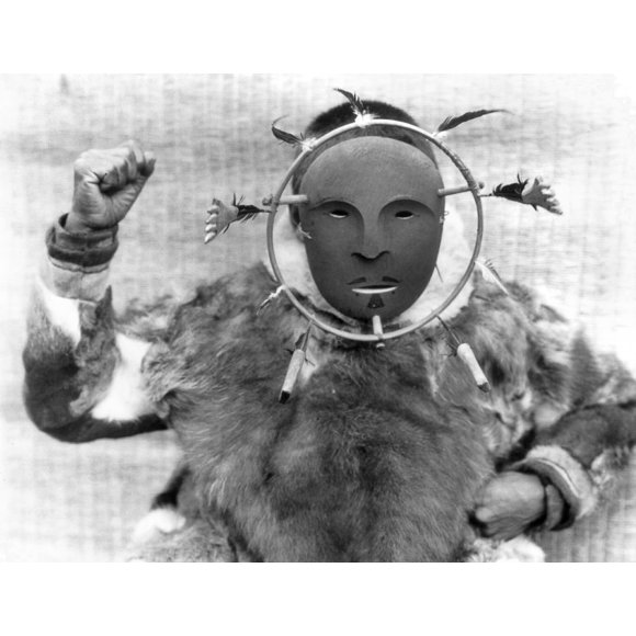 Alaska: Eskimo Mask, C1929. /Na Nunivak Native Wearing A Ceremonial Mask, Nunivak Island, Alaska. Photograph By Edward S. Curtis, C1929. Poster Print by (18 x 24)