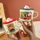 thumbnail image 1 of Taza Navideña de Cerámica con Diseño de Papá Noel | Capacidad de 400 Ml | Incluye Tapa de Silicona | Elegante Presentación Navideña, 1 of 6