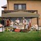 thumbnail image 5 of Khaki 10x10 pop - up awning: includes 1 side wall, 3 adjustable heights, roller bag, y 4 sandbags, 5 of 9