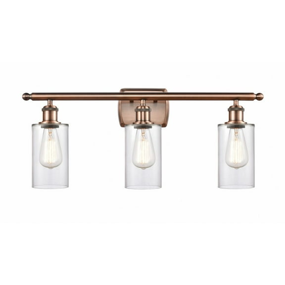 516-3W-AC-G802 Innovations Lighting Clymer - 3 Light Bath Vanity In Art Deco Style-12 Inches Tall and 26 Inches Wide-Antique Copper Finish-Clear Glass