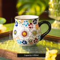 thumbnail image 2 of Taza de cerámica floral dibujada a mano: aislamiento de doble capa y apta for microondas for los amantes del café, 2 of 2