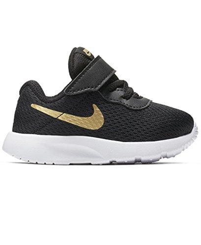 nike tanjun black metallic gold