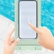 thumbnail image 4 of Bolsa impermeable universal para teléfono | Funda transparente IPX8 de PVC para smartphones hasta 6.5" | Acceso a pantalla táctil | Para natación, playa, viajes | Incluye cordón | Colores múltiples, 4 of 6