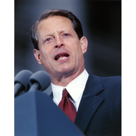 Al Gore Delivering a Speech wearing a Black Suit and A Red Tie Photo