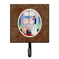 Carolines Treasures 7268SH4 Lady with her Schipperke Leash or Key Holder 7Hx4.25W multicolor